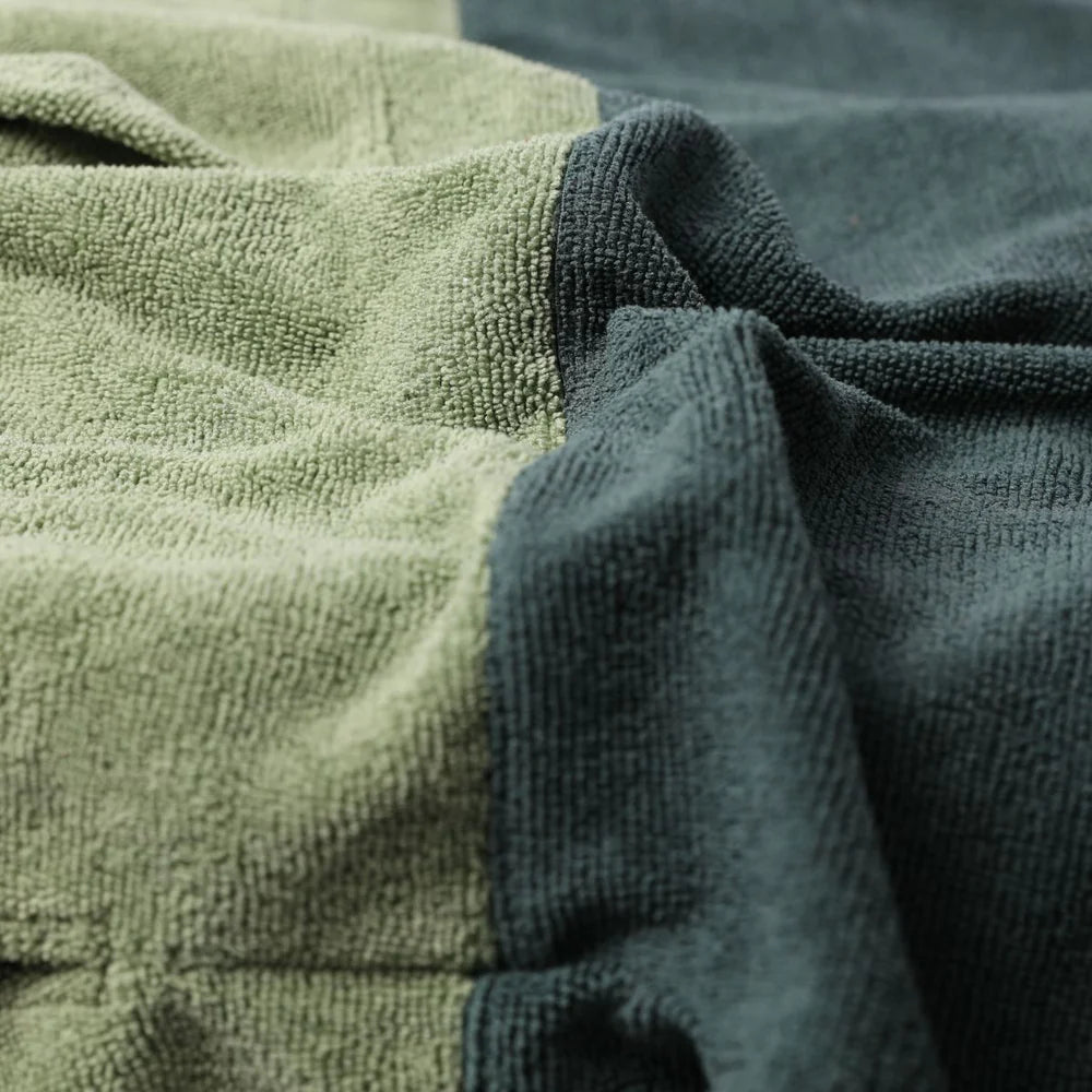 SOORUZ | Poncho laurel green | פונצ'ו סורוז ירוק דוגית
